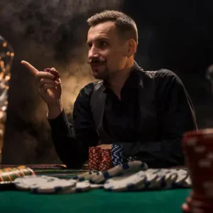 man-is-playing-poker-with-cigar-whiskey-man-winning-all-chips-table-with-thick-cigarette-smoke-concept-victory-glass-with-whiskey-stack-chips-foreground_639032-1745.webp